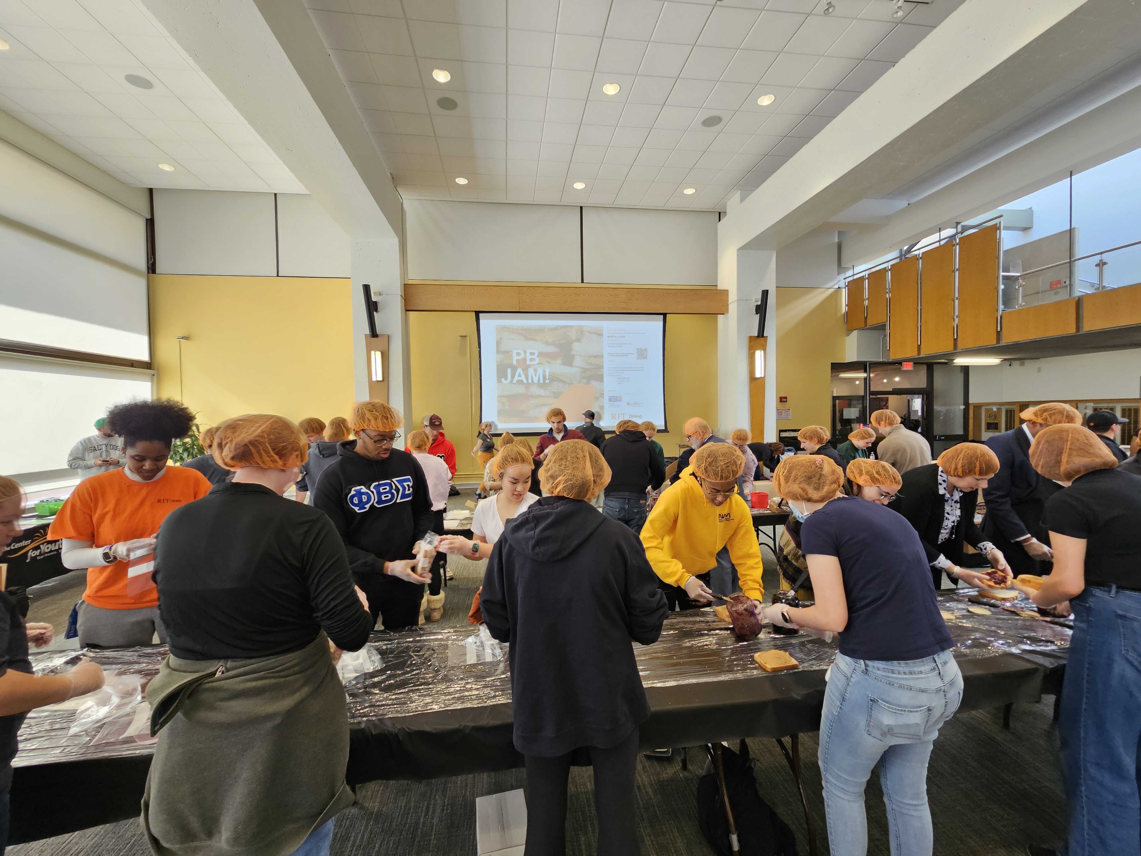 RIT students and staff assemble 2,000 peanut butter and jelly sandwiches to benefit Boys & Girls Club, Center for Youth, and YWCA as part of their 2024 United Way campaign